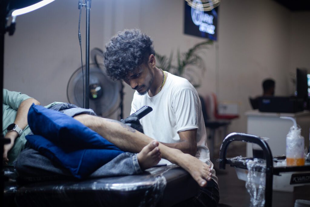 Tattoo training students working on real skin at Apex Tattooz, the best tattoo shop in Delhi