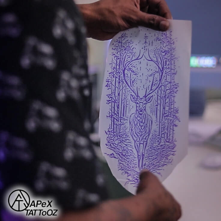 Stencil application for deer forearm tattoo