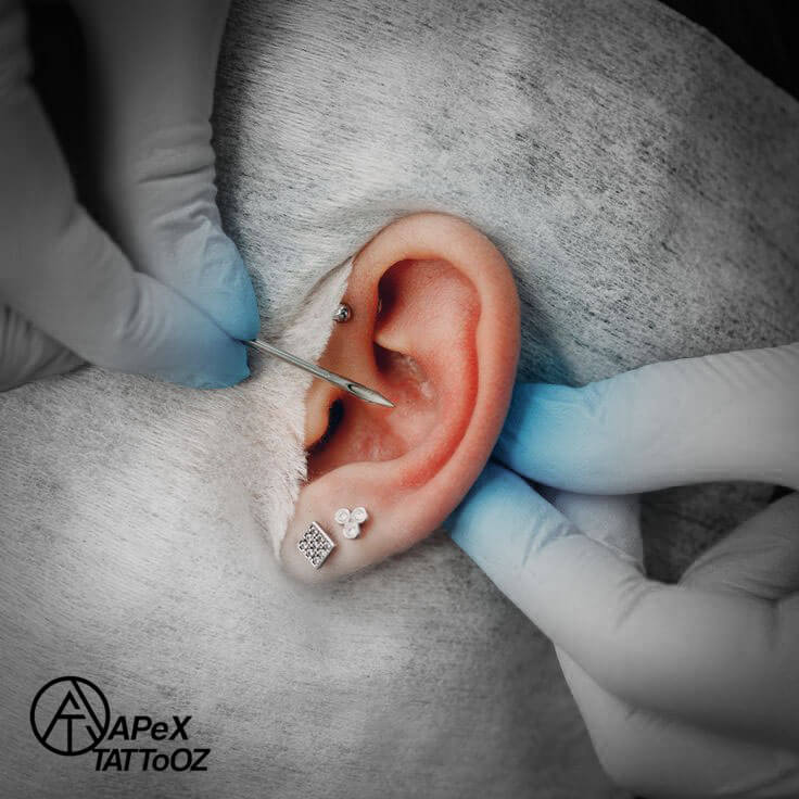 Professional ear piercing at Apex Tattooz Delhi using sterilized tools