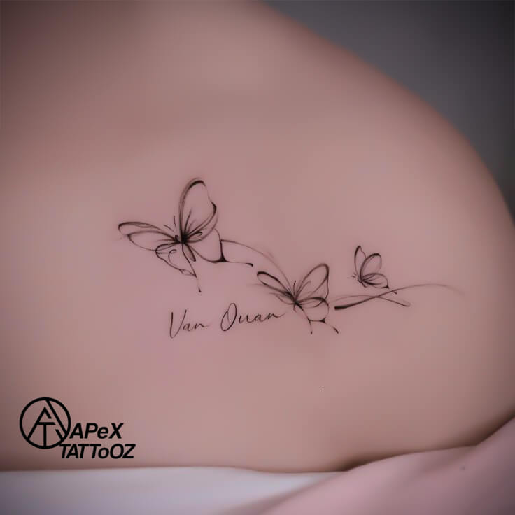 Butterfly collarbone tattoo