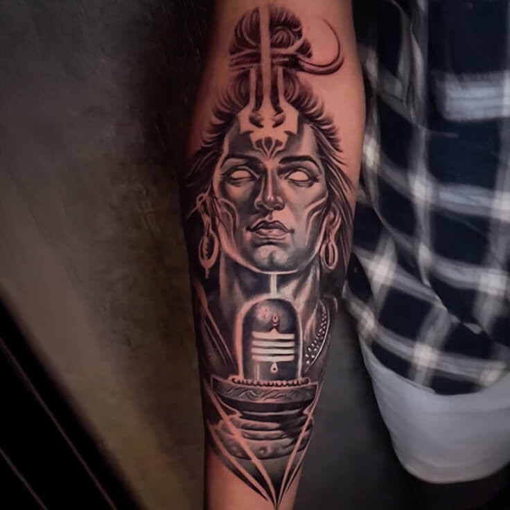 This forearm tattoo portrays Lord Shiva in meditative tranquility by Soumen Dutta.