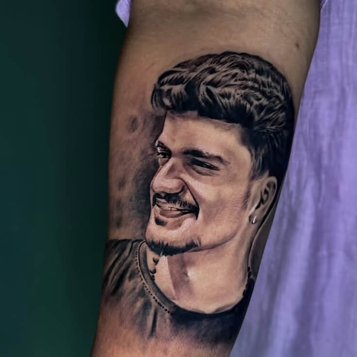 Black and grey portrait tattoo by Guru Pujar