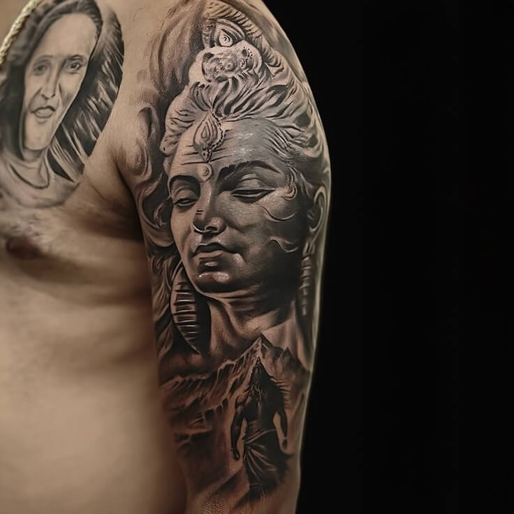 Shiva tattoo by Guru Pujar – cover-up tattoo on upper arm