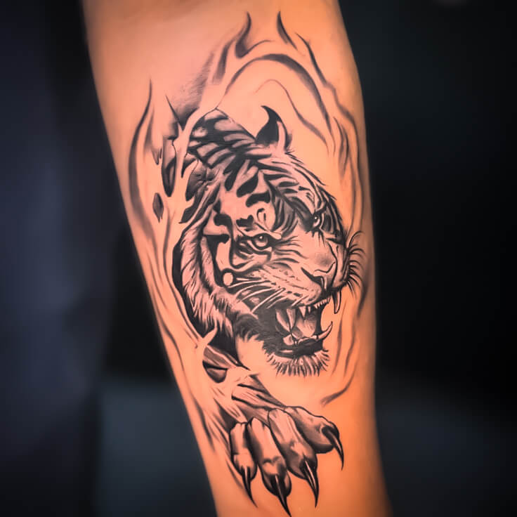 Roaring tiger blackwork forearm tattoo by Sohil Khan