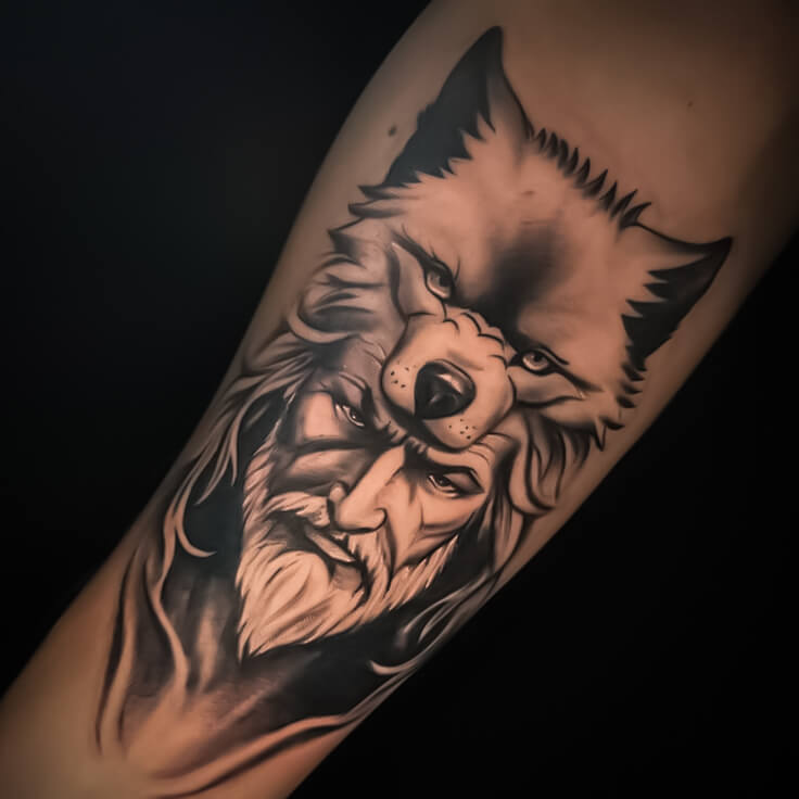 Bearded warrior with wolf head forearm tattoo by Sohil Khan
