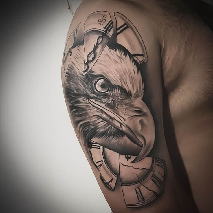 Eagle and broken clock bicep tattoo by Sohil Khan