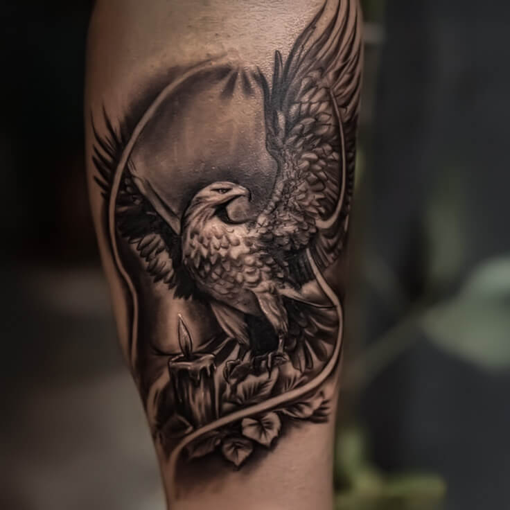 Eagle and candle blackwork tattoo by Gautam Birla