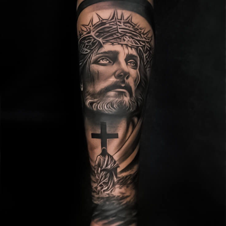 Jesus Christ and cross black and grey forearm tattoo by Vishal Gour