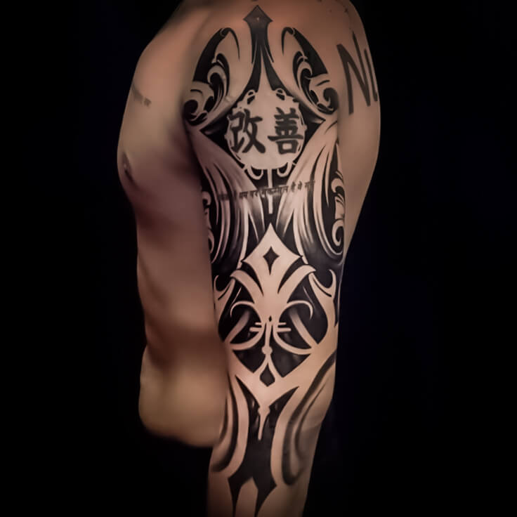 Tribal geometric upper arm tattoo by Vishal Gour