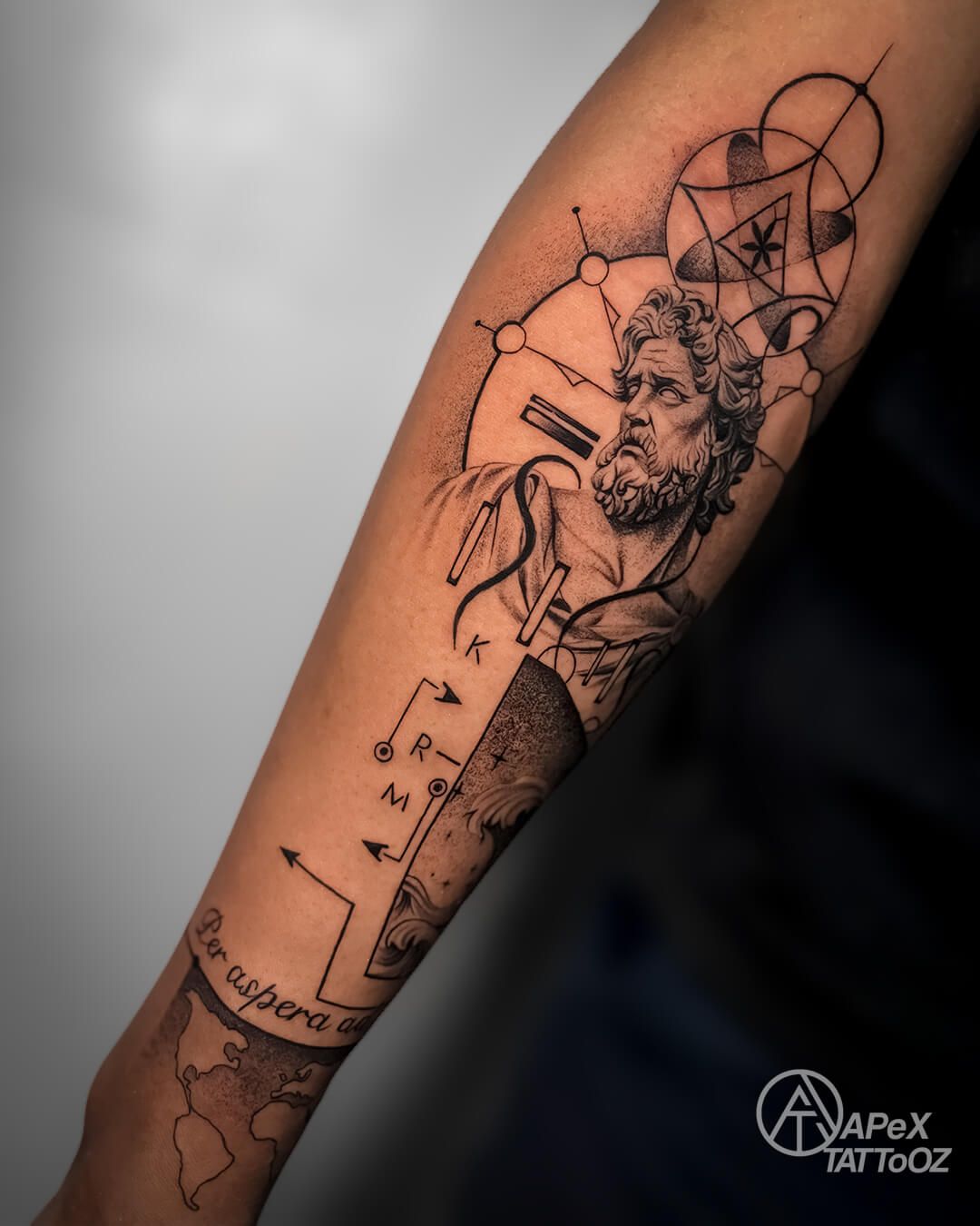 Full view of a custom geometric classical portrait forearm tattoo by Apex Tattooz