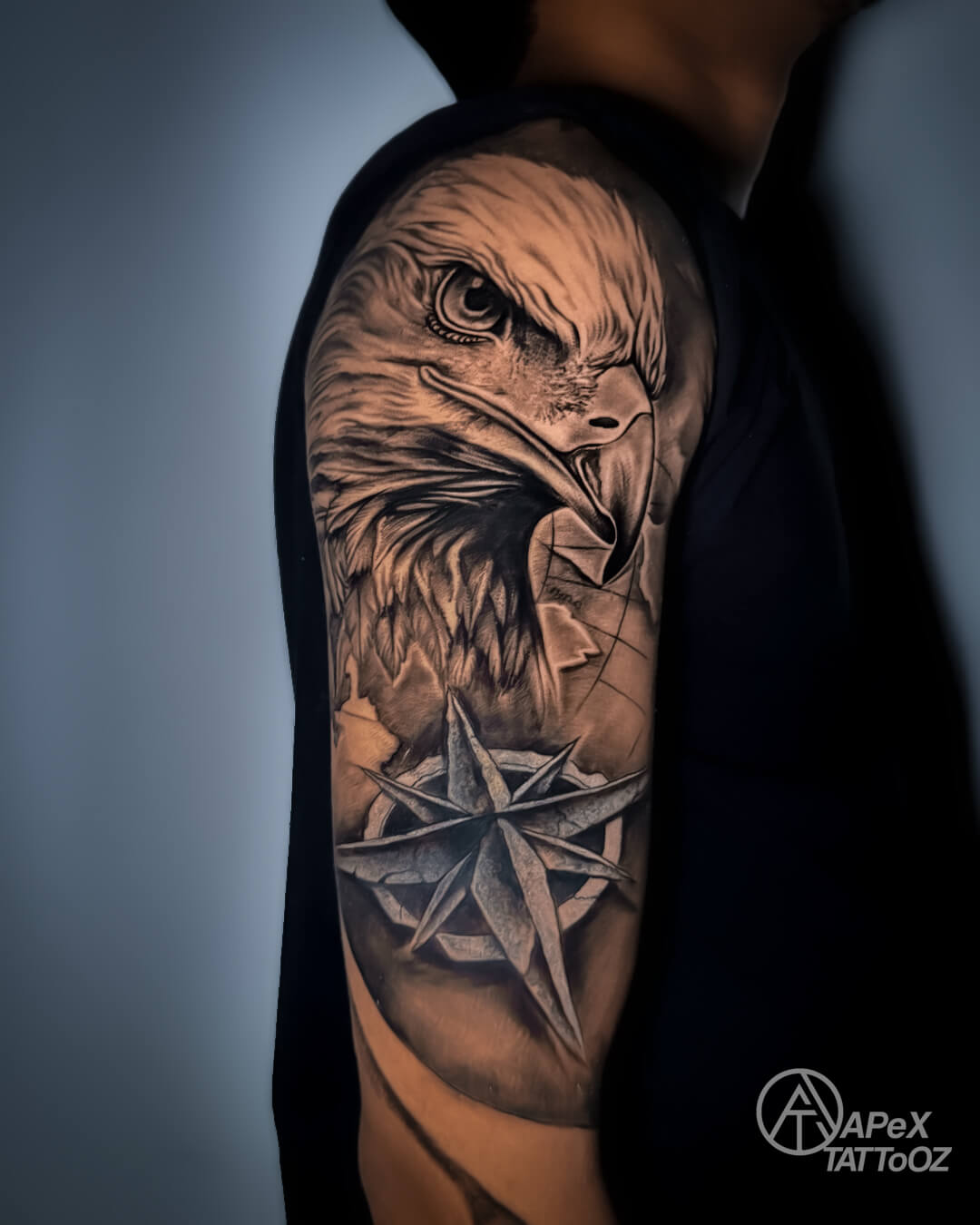 Black and grey eagle cover-up forearm tattoo by Apex Tattooz