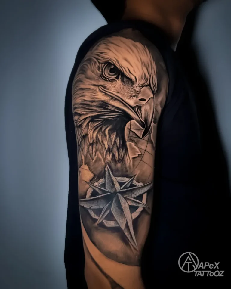 Eagle and compass upper-arm cover-up tattoo by Apex Tattooz Delhi
