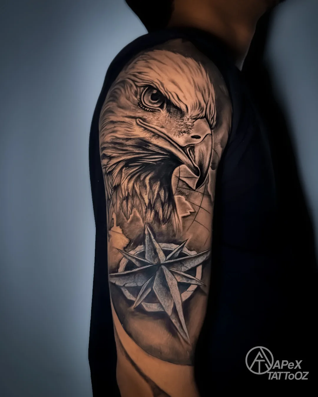 Eagle and compass upper-arm cover-up tattoo by Apex Tattooz Delhi