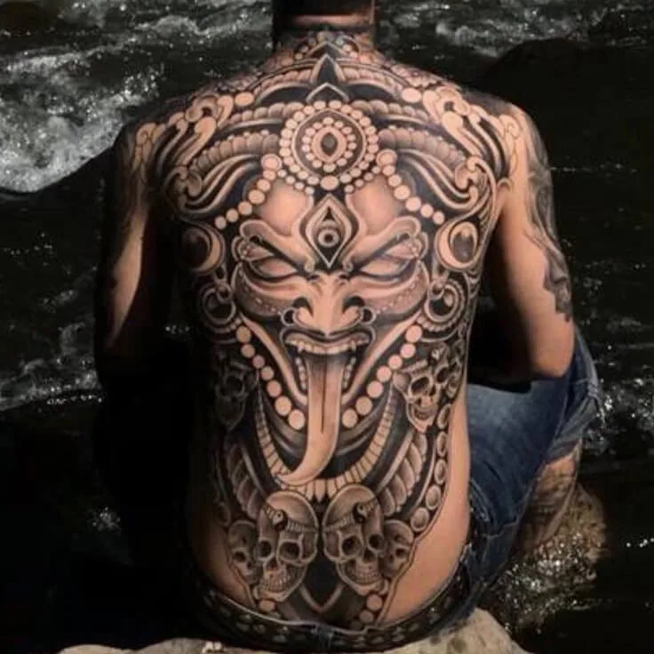 Kali-inspired full-back blackwork tattoo with skull and ornamental elements by Apex Tattooz