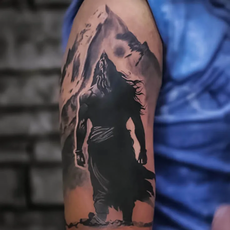 Shiva silhouette and mountain forearm tattoo in black and grey by Apex Tattooz
