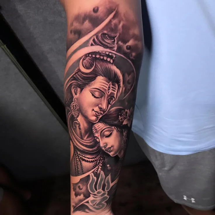 Shiva and Parvati black-and-grey forearm tattoo by Apex Tattooz