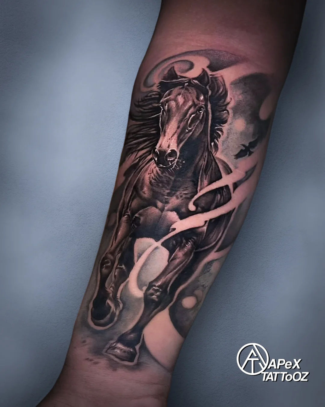 Black and grey running horse forearm tattoo by Tanmay in Delhi