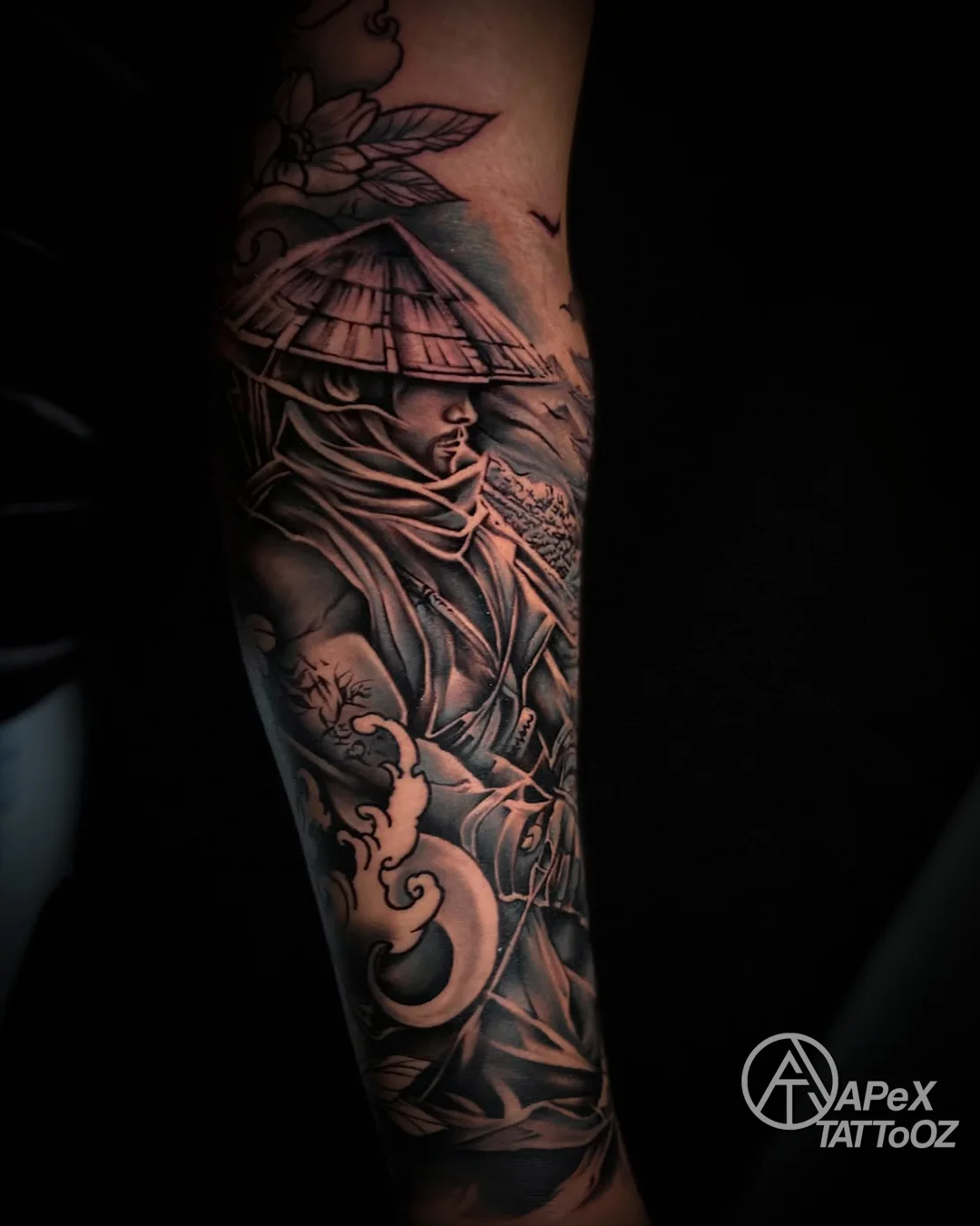 Black and grey samurai forearm tattoo by Tanmay at Apex Tattooz Delhi