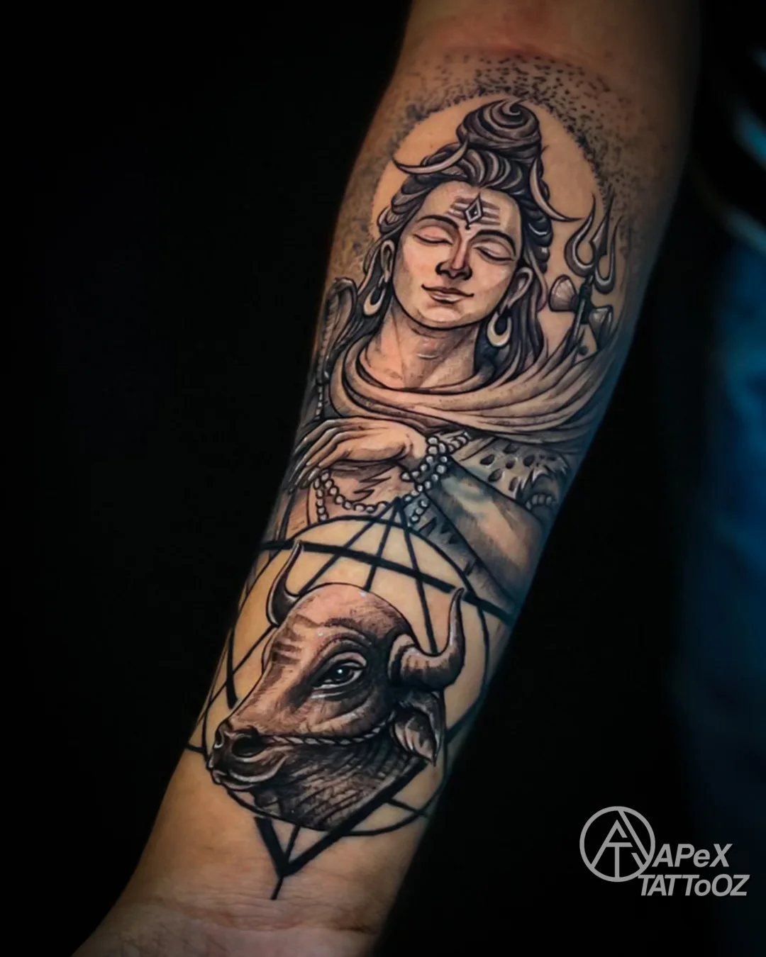 Shiva and Nandi black and grey forearm tattoo by Tanmay in Delhi