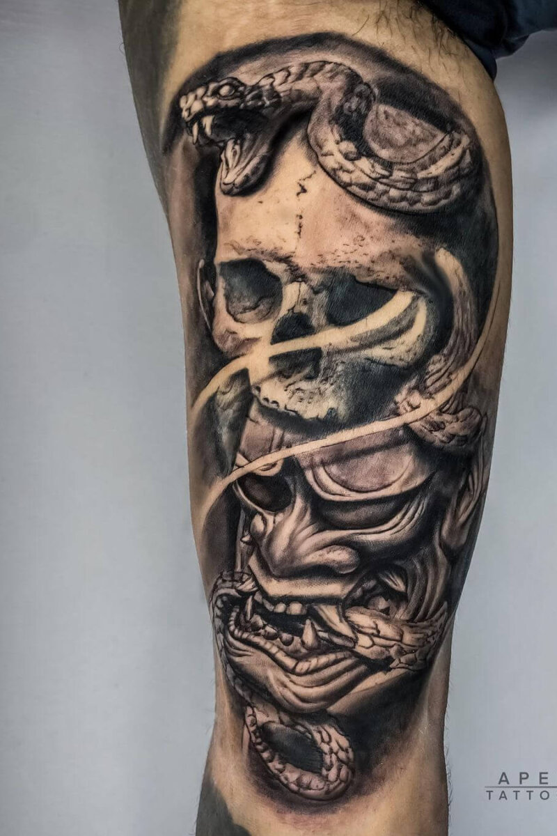 Custom Hannya mask tattoo with skull and snake elements, inked at Apex Tattooz — a top tattoo shop in Delhi