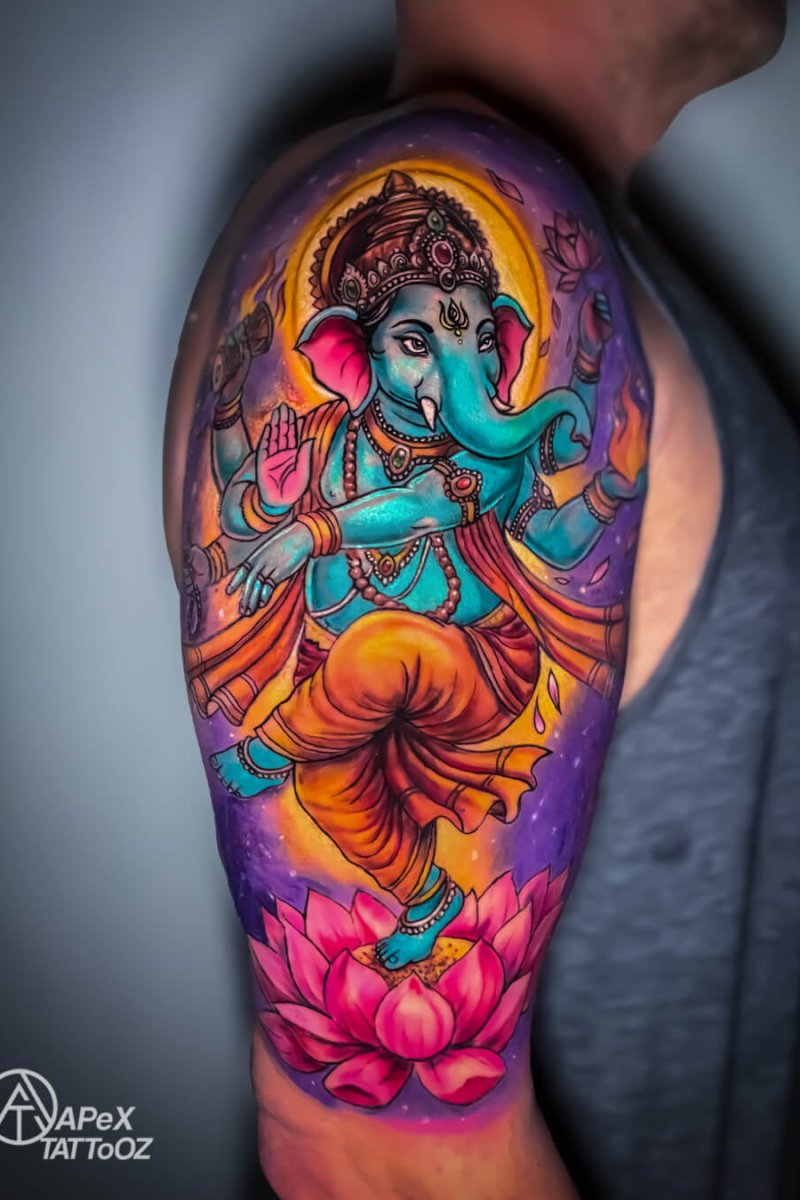 Colourful Ganesh tattoo on shoulder by Apex Tattooz Delhi NCR
