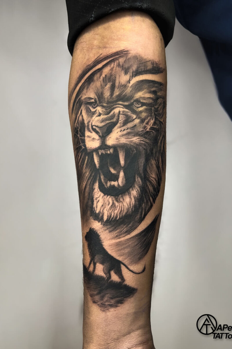 Customized lion tattoo symbolizing strength and royalty, inked at Apex Tattooz, a top tattoo shop in Delhi